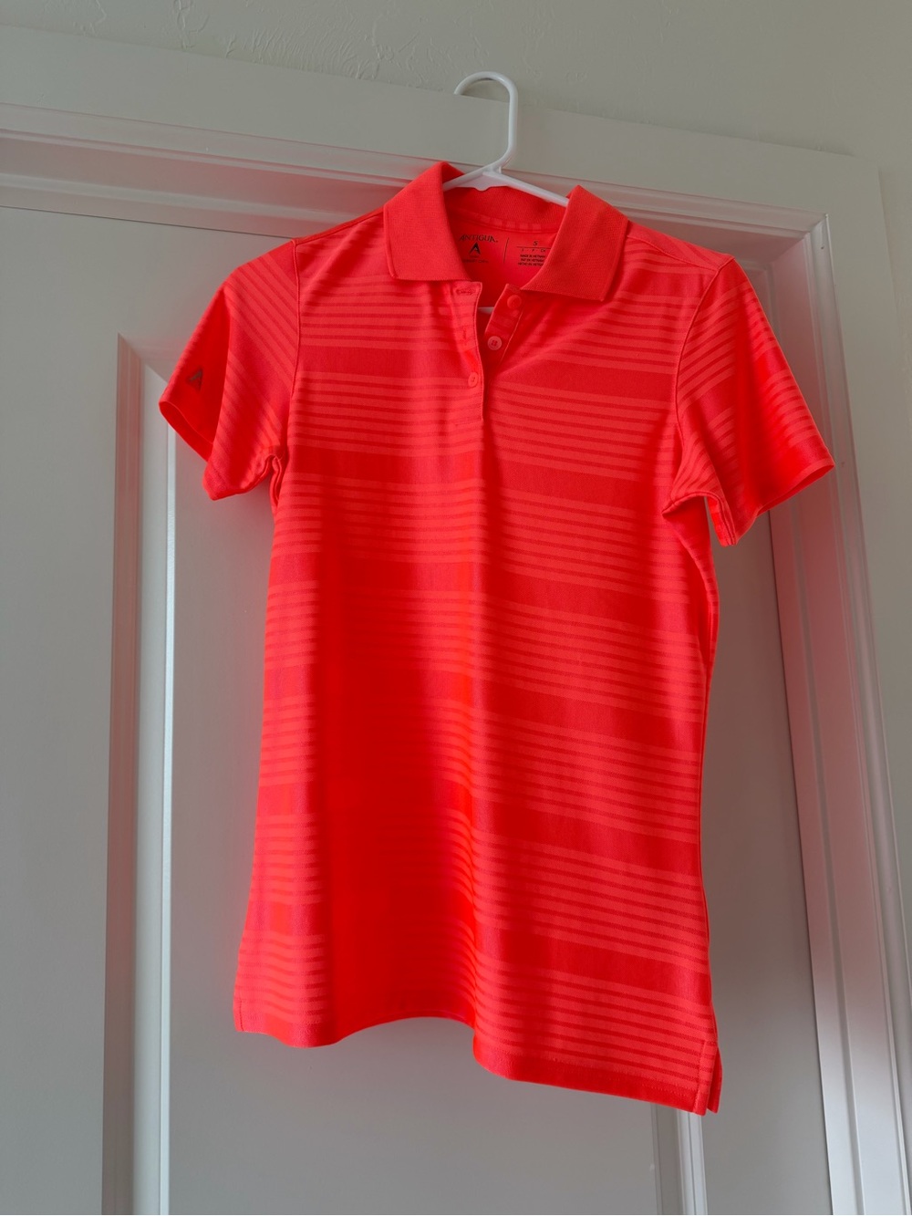 Antigua Women's Neon Coral Polo Top